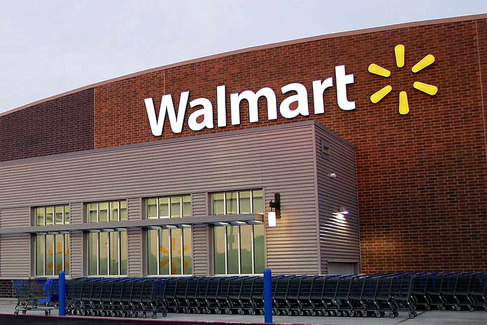 The front of a Walmart store with the company’s name above the entrance